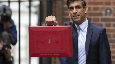 Rishi Sunak holds up a red chancellor briefcase