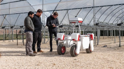 University of Lincoln showcase their agri-robot, a white and red four-wheeled robot